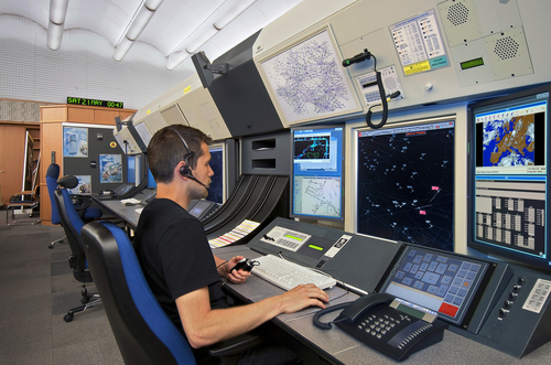 Air traffic controller sat working at a computer